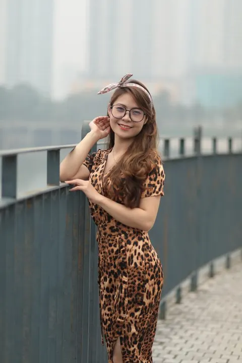 Asian Woman in a Skirt and Glasses Poses Outdoors – photo 20 of 21