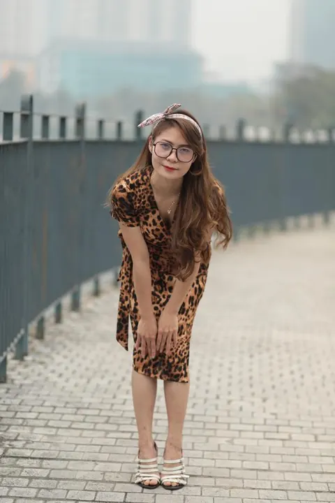 Asian Woman in a Skirt and Glasses Poses Outdoors – photo 13 of 21