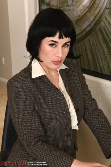 Olive Glass – Short-Haired MILF Strips Out of Her Lingerie in the Office