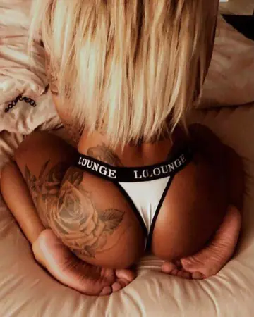 Tattooed Amateur Poses in a Thong and Shows Her Ass