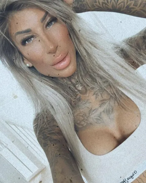 Tattooed Amateur Poses in a Thong and Shows Her Ass – photo 7 of 16