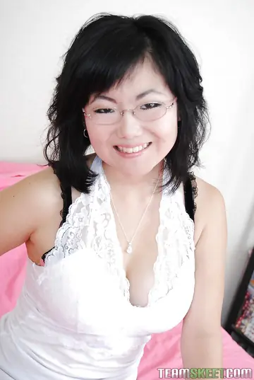 Chi Yoko – Busty Asian Brunette in Glasses Strips Out of Her Skirt and Panties