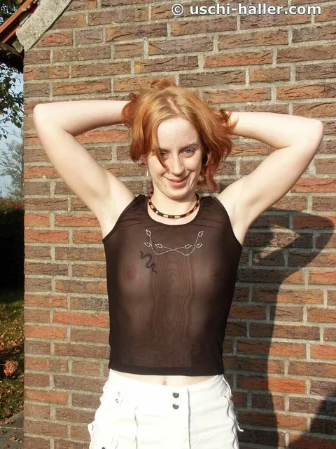Redhead with Tattoo Shows Her Shaved Pussy in the Garden – photo 4 of 16