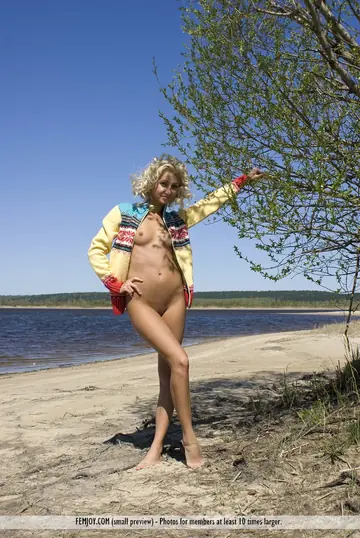 Curly European Blonde Spreads Her Shaved Pussy on the Beach