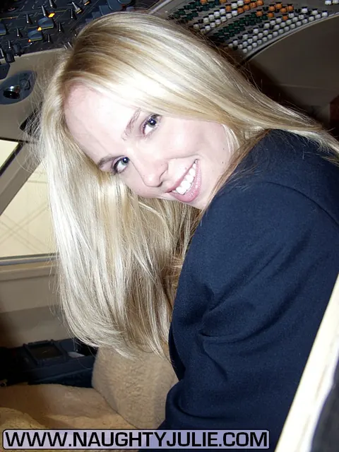 Naughty Julie: Blonde in Uniform Spreads Her Shaved Pussy in a Plane Cockpit – photo 7 of 16