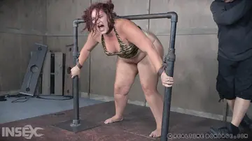 Curvy Redhead Spreads Her Shaved Pussy While Bound in Bondage