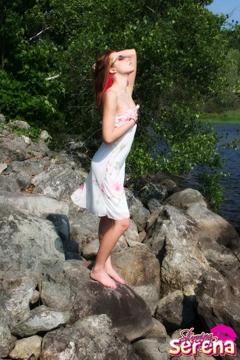 Stunning Serena: PAWG Redhead in a Skirt and Glasses Poses on Waterside Rocks – photo 4 of 12