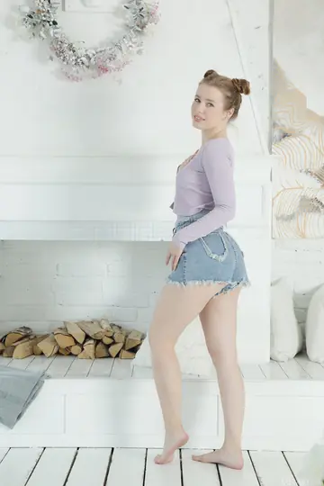 Woman Undresses Fully and Poses Nude Before the Lens