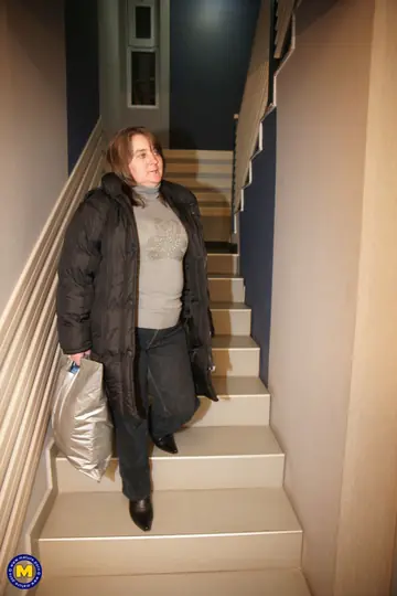 Mature Curvy Woman Strips Out of Her Jeans in the Bathroom