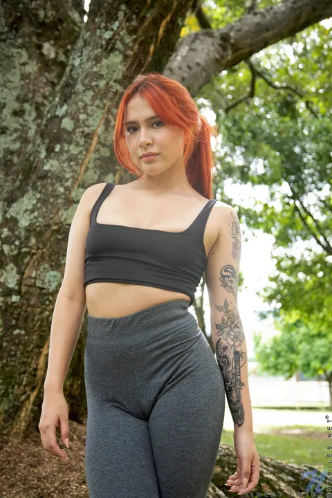 Violet Prydz: Thick Latina Redhead Poses in Yoga Pants Outdoors – photo 10 of 21