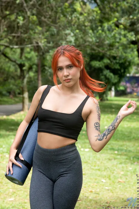 Violet Prydz: Thick Latina Redhead Poses in Yoga Pants Outdoors – photo 1 of 21