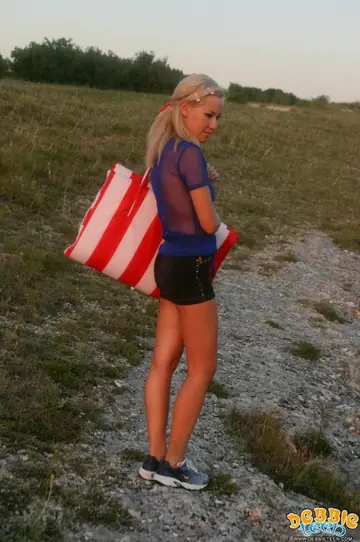 Thick Blonde Strips Out of Her Shorts on a Seaside Cliff