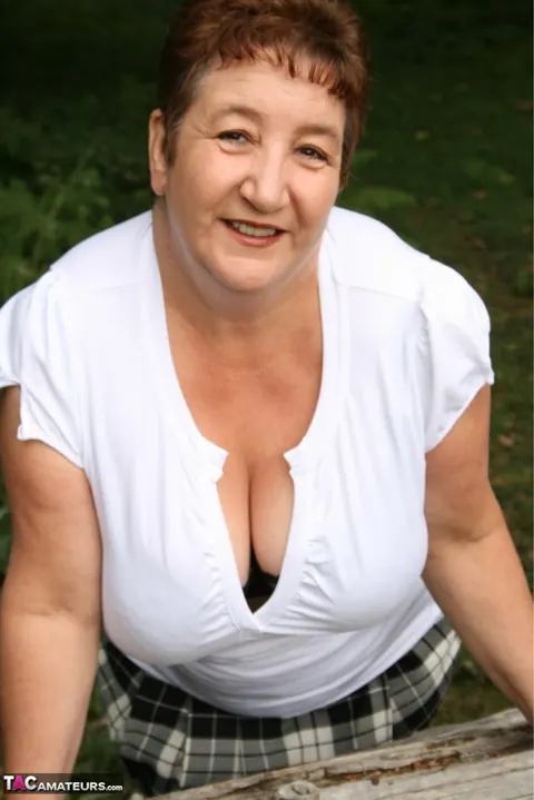 Kinky Carol: Curvy British MILF Flaunts Her Big Natural Tits Over a Rustic Fence – photo 10 of 16