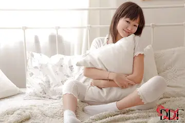 Asian Brunette Removes Pants and Fingers Her Pussy