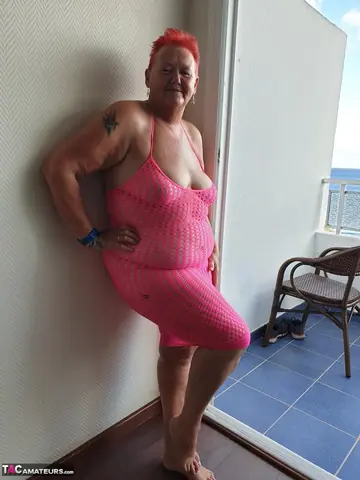 BBW Redhead Lifts Her Skirt and Spreads Her Pussy on a Balcony