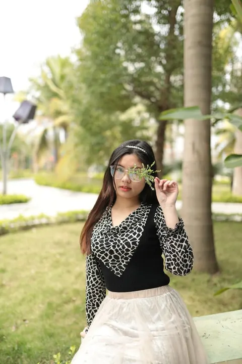 Asian Brunette in Glasses and Skirt Poses Outdoors – photo 5 of 21
