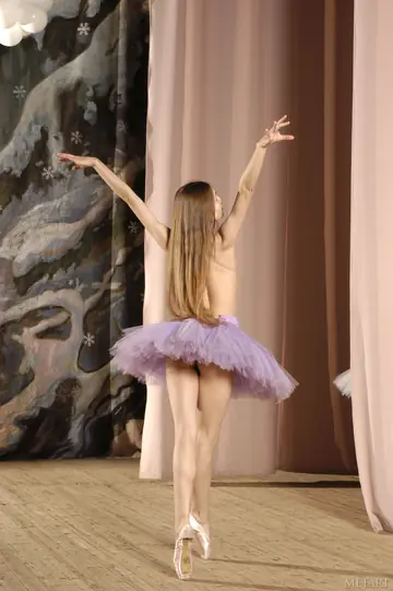 Skinny Woman Poses Nude in a Costume