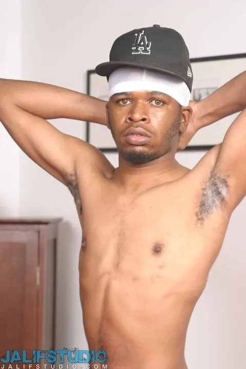 Hairy Black Man Strips Nude and Shows His Huge Cock – photo 7 of 21