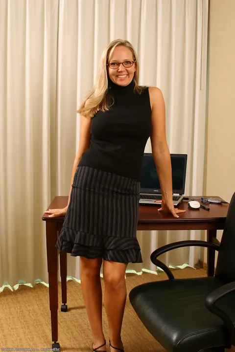 Busty Mature Blonde Strips Out of Her Uniform in the Office – photo 2 of 21