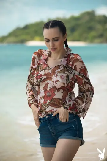 Brunette with Pigtails Shows Her Big Natural Tits on the Beach
