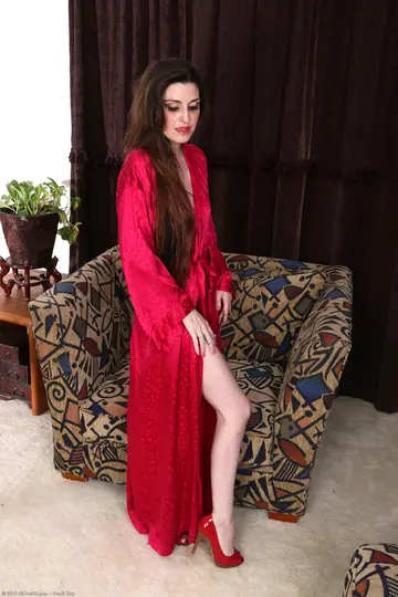 Mature Latina Strips Off Her Red Panties to Show Her Hairy Pussy