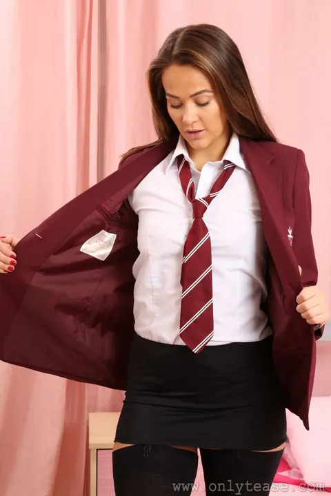 Felicity Hill: Brunette in Stockings and Uniform Teases Her Ass – photo 1 of 21