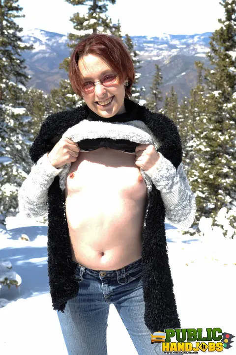 Redhead in Jeans and Glasses Gives a Handjob Outdoors – photo 2 of 21