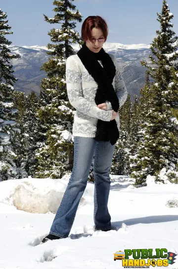 Redhead in Jeans and Glasses Gives a Handjob Outdoors
