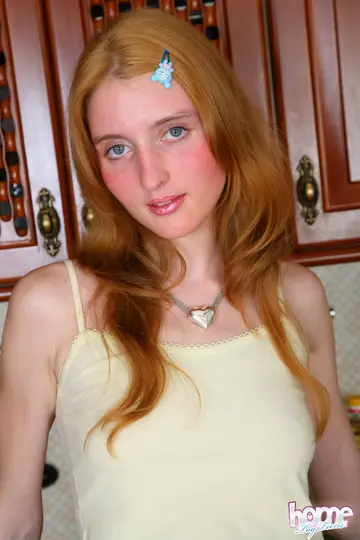 Pale Redhead Masturbates with a Huge Dildo on the Kitchen Counter