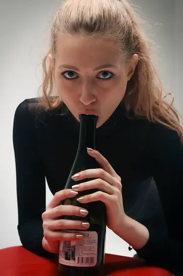 Blonde in Lingerie Spreads and Inserts a Wine Bottle