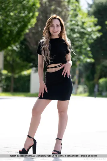 Woman in a Skirt and Heels Spreads Her Legs for Nude Selfie