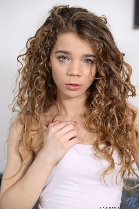 Sabrina Spice: Petite Curly Babe in Uniform Spreads Her Pierced Pussy – photo 1 of 20
