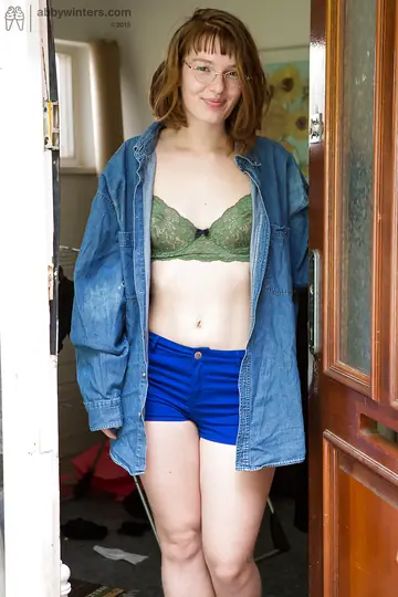 Short-Haired Redhead with Glasses Fingers Her Hairy Ass and Pussy