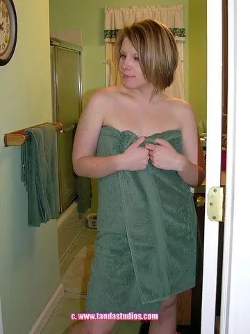 Short-Haired Redhead MILF Fingers Her Pussy in the Bathroom