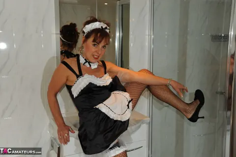 Mature Redhead Undresses from Maid Uniform in the Bathroom – photo 10 of 20