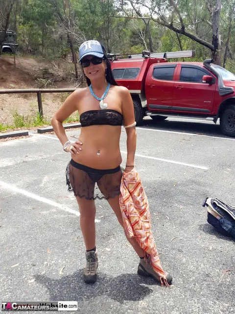Brunette MILF Lifts Her Skirt and Flashes Her Shaved Pierced Pussy Outdoors – photo 1 of 16