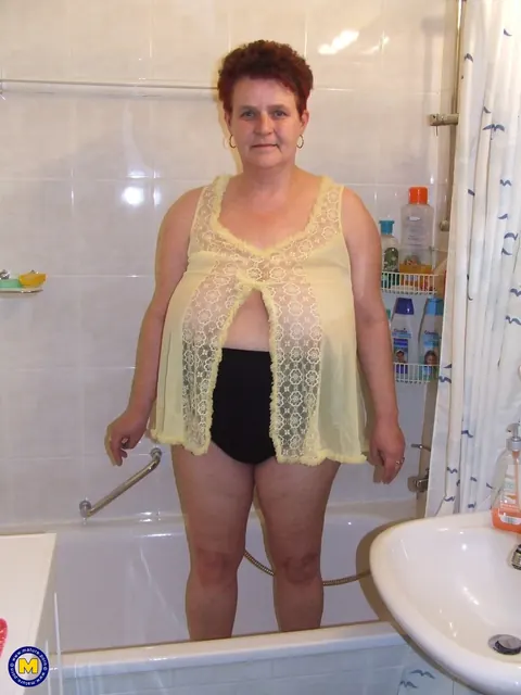Curvy Mature Housewife Strips Nude in the Bathroom – photo 1 of 21