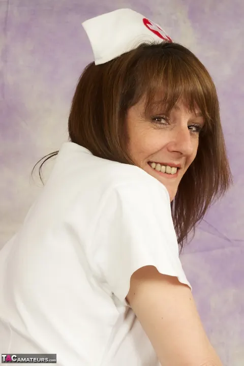 Mature Nurse in Uniform and Heels Flashes Thong for Doctor – photo 6 of 16