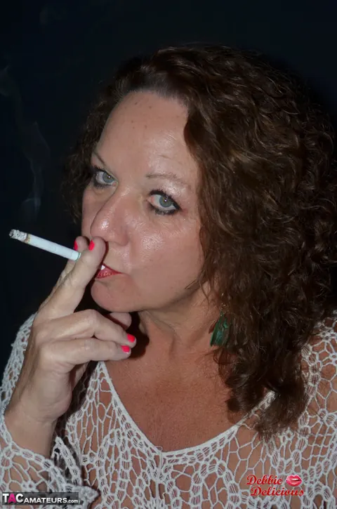 Debbie Delicious: Thick Mature Brunette Smokes in Leather Before Fingering – photo 7 of 20