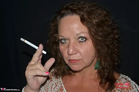 Debbie Delicious: Thick Mature Brunette Smokes in Leather Before Fingering – photo 6 of 20