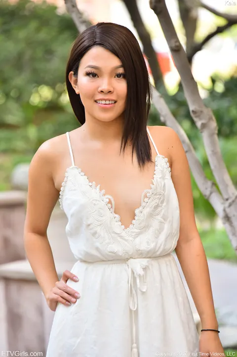 Asian Woman Pulls Her Panties Aside and Spreads Her Shaved Pussy in Public – photo 12 of 15