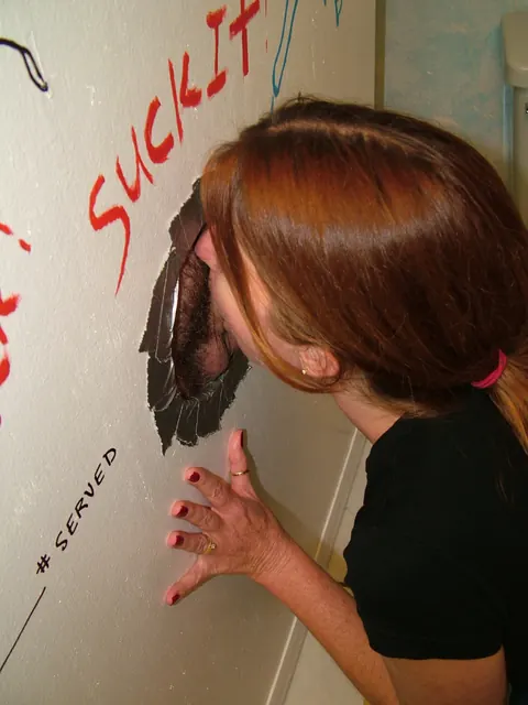 Dee Delmar: Mature Redhead Sucks Cock at Gloryhole and Takes a Facial – photo 1 of 20