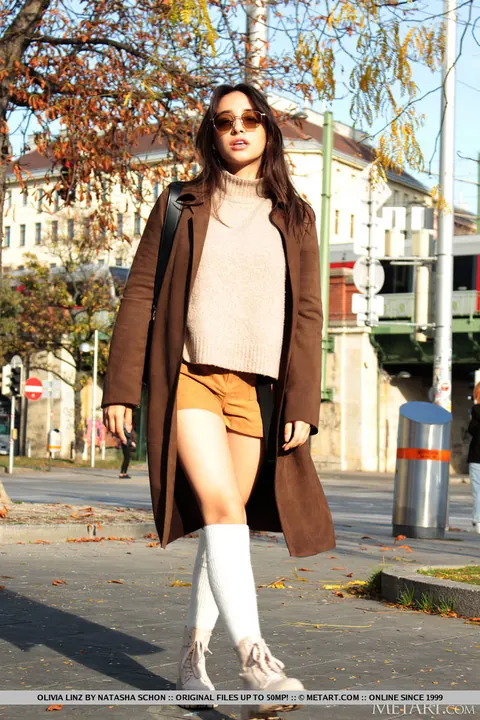 Olivia Linz: Thick Brunette Strips Out of Her Shorts and Stockings Outdoors – photo 1 of 18