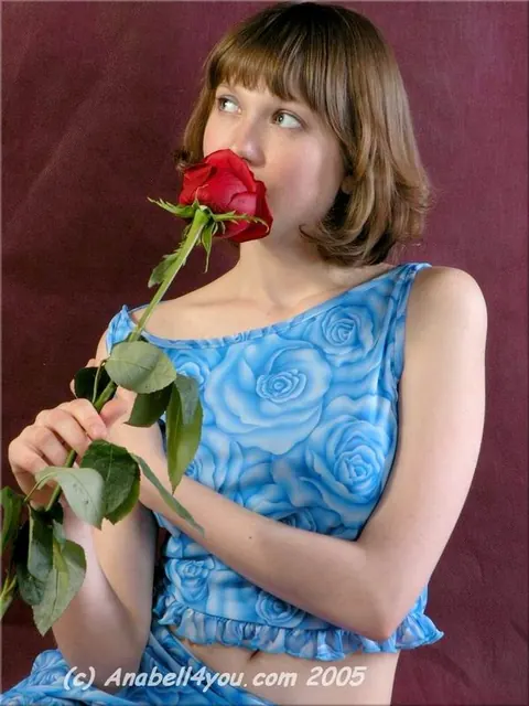 Busty Brunette Strips Out of Her Panties Holding a Red Rose – photo 2 of 15