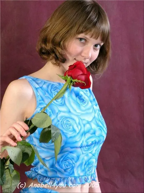 Busty Brunette Strips Out of Her Panties Holding a Red Rose – photo 1 of 15