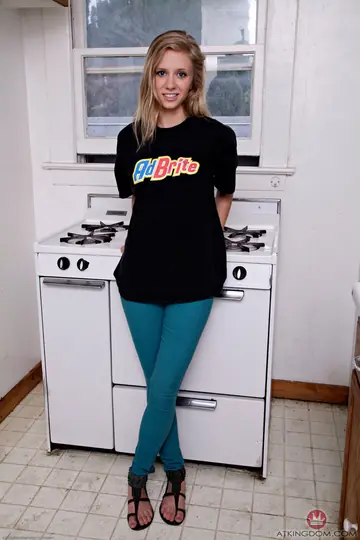 Petite Blonde in Jeans Undresses and Spreads Her Pussy on the Stove