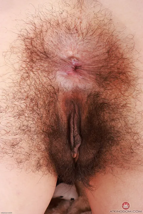 Latina Undresses to Reveal Her Very Hairy Pussy – photo 16 of 21