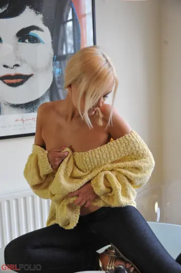 Blonde Pulls Down Her Jeans and Fingers Her Shaved Pussy