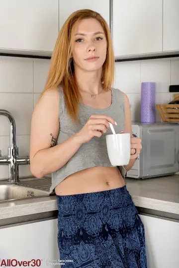 Redhead MILF Strips Naked for Her Kitchen Debut