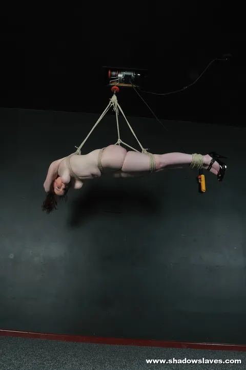 Thick Brunette with Big Tits Suspended in Rope Bondage in High Heels – photo 15 of 16